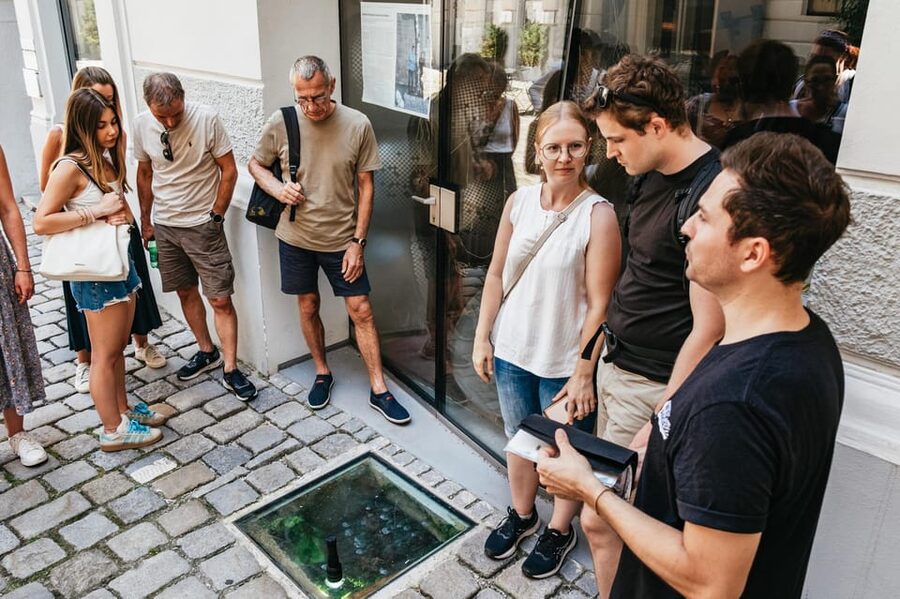 Vienna: Viennese Underworld Guided Walking Tour - Going down the stairs into old private cellars